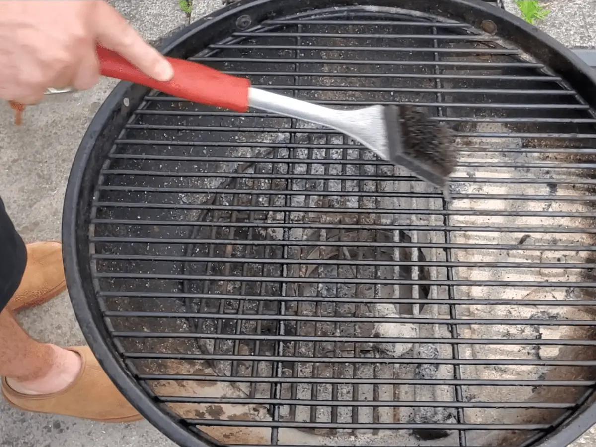 how to clean a charcoal grill scraping the grate